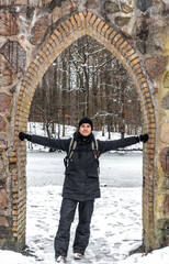Fototapeta na wymiar young man in warm clothes enjoying a forest with snow in Denmark