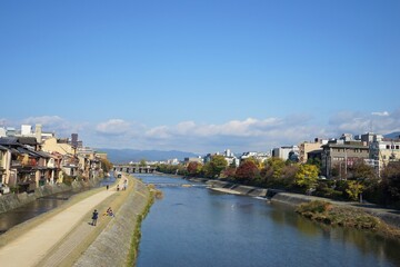 Fototapeta na wymiar View of Kamo-gawa also known as Kamo River and Pontocho area in Kyoto, Japan - 鴨川 先斗町 京都 日本