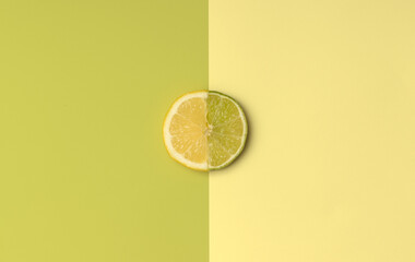 Half Lemon and Lime slice with green and yellow color opposite for spring or summer background....