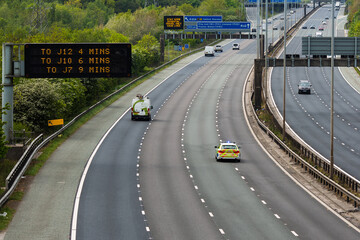 A police car responding to an emergency on the M60 motorway in UK
