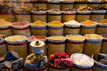 Variety of colorful Arabic spices and herbs on the arab street market stall. Dubai Grand Spice Souk, United Arab Emirates.