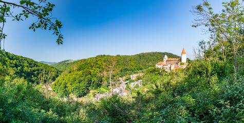 Fototapeta na wymiar Panorama view of medieval castle Krivoklat, Czech Republic. Sunny day during summer, fresh forest near the castle.