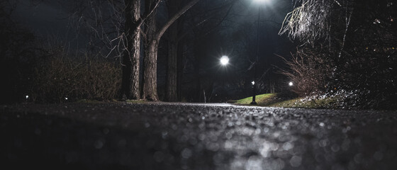 Selective focus shot of a empty walkway in the park at night,  on Reimersholme¨ islet in Stockholm, Sweden