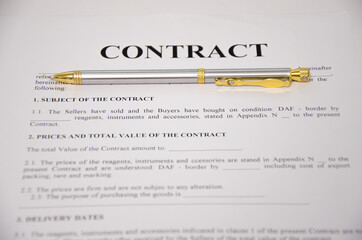 the pen is on the contract and the contract is on a white background