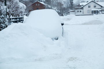 snowbound car beside the street, winter in germany