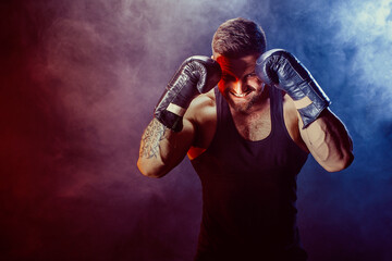 Sportsman boxer fighting on black background with shadow. Copy Space. Boxing sport concept. Smoke...