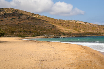 Fototapeta na wymiar Psathi Beach, a large, sandy and isolated beach on the east coast of Ios island. Cyclades, Greece