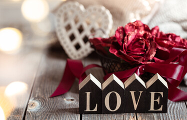 Festive composition for Valentine's Day with decorative word love close up.