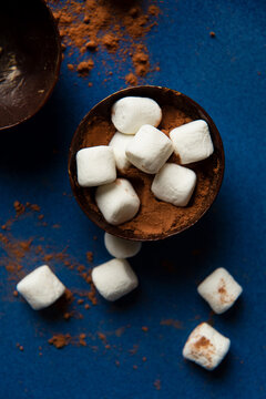 Partially filled chocolate shells for hot chocolate bombs.