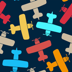 Beautiful bright colorful multicolored biplanes isolated on dark blue background. Cute airplane seamless pattern. Top view. Vector flat graphic illustration. Texture. © far700