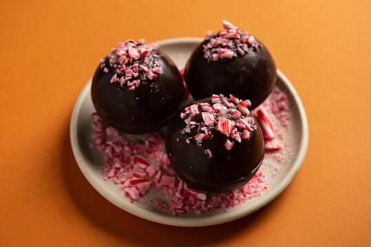Hot chocolate bombs decorated with crushed candy canes