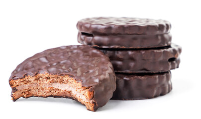 Heap of cookies with filling in chocolate on a white background, sandwich biscuits. Isolated