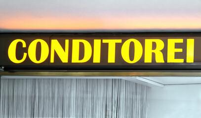 Store sign conditorei - confectionery on a house facade