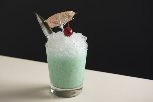 Blue tiki cocktail on pebble ice