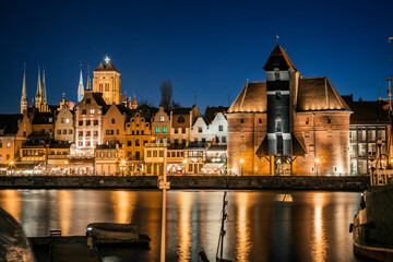 Fototapeta na wymiar Historic old town and historic port crane in Gdansk in the evening time, Poland