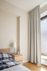 Beige bedroom with window