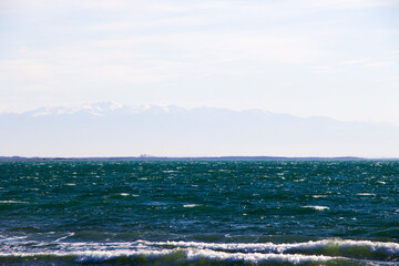 Stormy weather, waves and splashes in Georgia. Stormy Black sea. Water background.