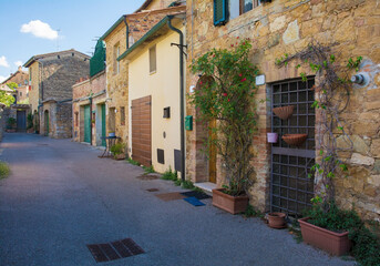 A residential road in the historic medieval village of San Quirico D'Orcia, Siena Province, Tuscany, Italy
