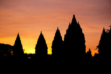 Silhouettes of Prambanan temple at sunset