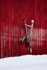 old ard hanging on the wall of a barn at toten, norway