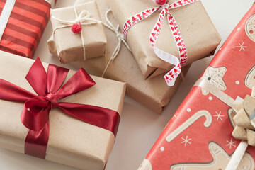 Gift boxes with ribbons on wooden background. 
Birthday gifts. Holiday presents.