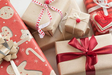 Gift boxes with ribbons on wooden background. 
Birthday gifts. Holiday presents.