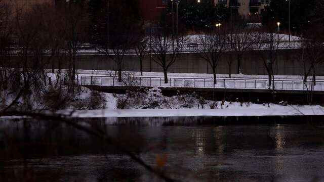 afternoon river running frozen cold water winter snow in minneapolis minnesota midwest usa 4k