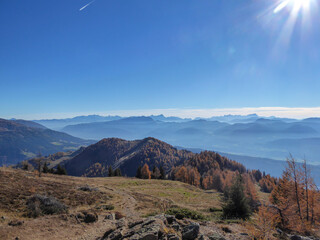 A distant view on the Millstaetter lake in Austrian Alps. Sunny and bright autumn day. The lake is...