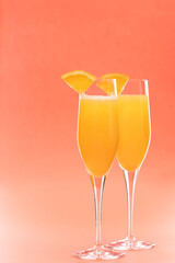 Two glasses of mimosa cocktail - 404602104