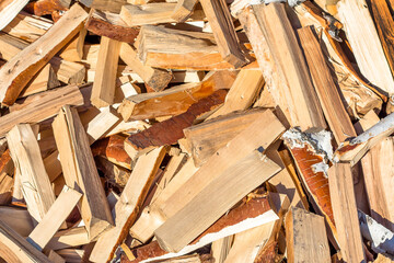 A pile of chopped birch wood. Firewood and biofuels
