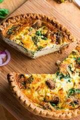 Quiche. Farm fresh eggs mixed with spinach, bacon, ham, sausage, cheese, vegetables poured in a pie crust and baked. Classic American restaurant or French Bistro breakfast or brunch favorite.