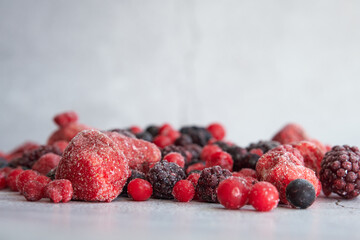 red berries scattered on a white background