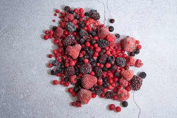 red berries scattered on a white background