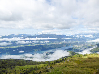 A panoramic view on the Millstaettersee from Granattor in Austrian Alps. The distant lake is...