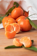 pieces of mandarins and whole mandarins on table