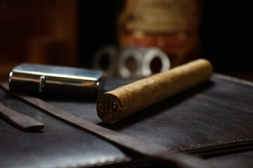 Fototapeta na wymiar Cigar on a notebook case 