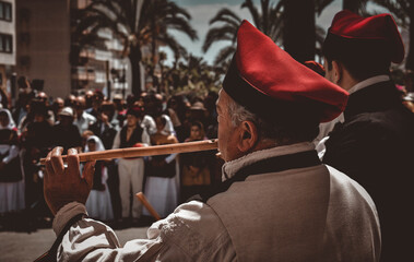 Ibiza Town, Ibiza / Spain - 5 05 19: Selective focus on an man, part of a folklore group, dancing in traditional dress at a celebration of Spanish and Balearic culture