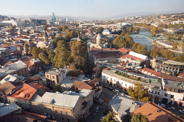 Fototapeta na wymiar Tbilisi Georgia aerial drone view from above, Kura river and old town of Tbilisi cityscape
