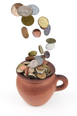 Money coins rain falling down in to the clay pot, isolated on a white background