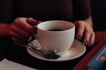 a cup of tea in beautiful female hands
