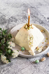 Paskha and kulich with pistachios. Traditional Russian Orthodox Easter Quark Dessert Curd. Easter food background. Traditional cottage cheese cake