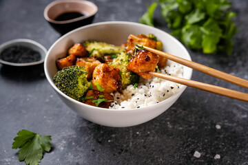 Fried vegan tofu bowl with broccoli and rice