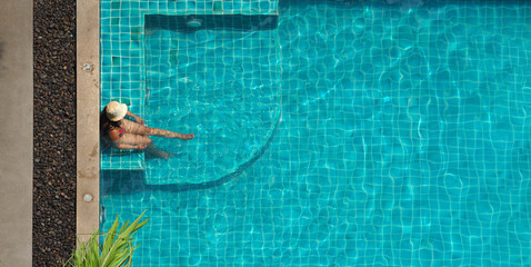 People swimming in pool. In summer sunny day swimming pool blue color clear water and people...