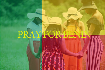 Pray for Benin. Group of four african women holding hands and praying. Concept of crisis in Africa country.