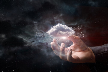 Fototapeta na wymiar Hand shows clouds on the background of outer space.