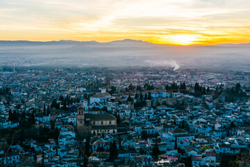 Alhambra palace in Granada at sunset from San Miguel lookout