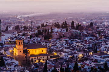 City of Granada in Spain at night from San Miguel lookout and San Nicolas Church with lights