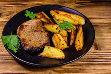 Roasted beefsteak with the fried potato and parsley