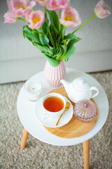 Bouquet of beautiful tulips in a vase in a home interior.