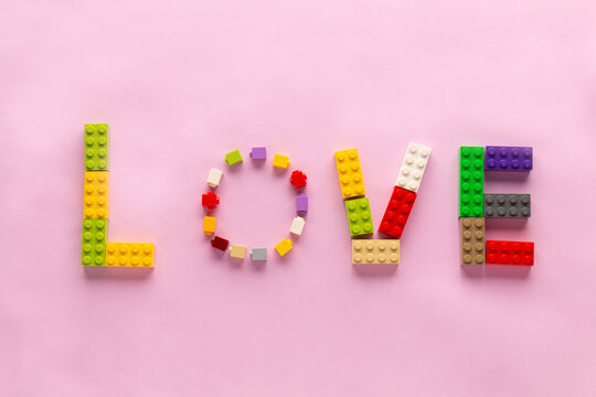 valentine's day word love on a pink background